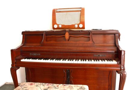 old piano with old transistorの写真素材