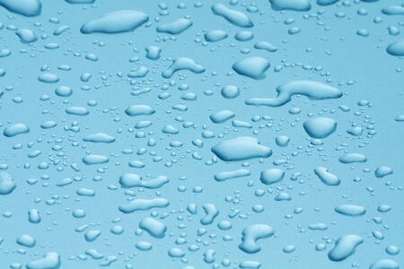 water drops on blue surfaceの写真素材