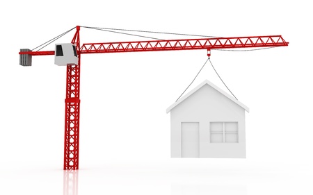tower cranes lifting houseの写真素材
