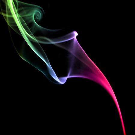 Abstract colorful smoke on black backgroundの写真素材