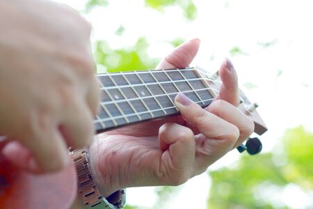 hand playing ukuleleの写真素材