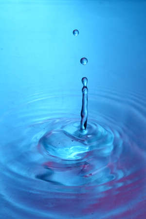 drop of water in blue colorの写真素材