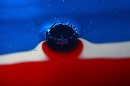 water drop in red, white and blue colorの写真素材