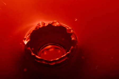 water drop in red colorの写真素材