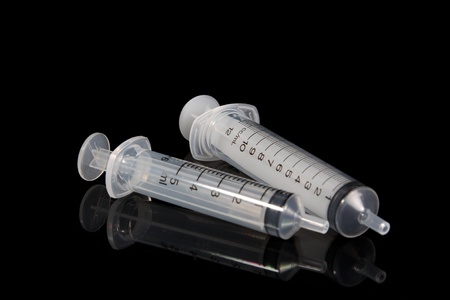 syringe on black backgroundの写真素材