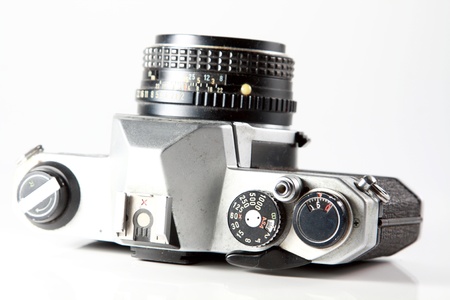 old film camera on white background