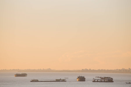 Silhouette boat under sunsetの写真素材
