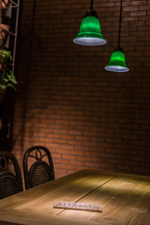 wooden reserved sign in restaurant