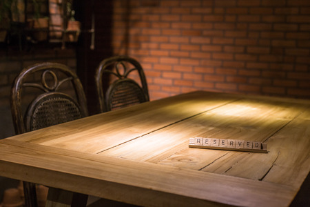 wooden reserved sign in restaurantの写真素材