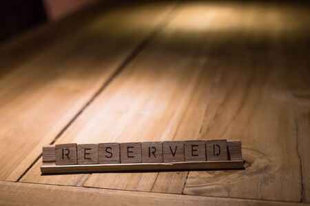 wooden reserved sign in restaurantの写真素材