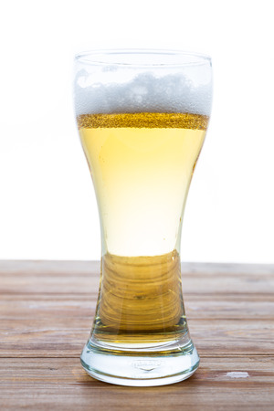 beer in a glass on white backgroundの写真素材