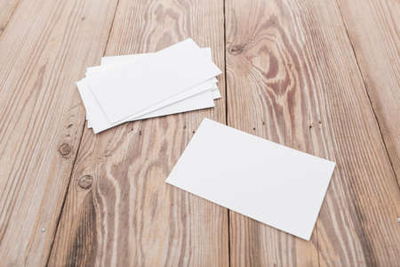 blank business card on wooden tableの写真素材