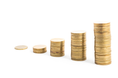 gold coin stack isolated on white backgroundの写真素材