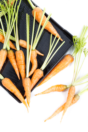 fresh baby carrot on white backgroundの写真素材