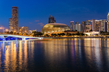 SINGAPORE - MARCH 2, 2015: Sunset scene of Singapore skyline with Esplanade theatre on march 2, 2015. Esplanade theatre is a 60,000 square metres performing arts center located in Marina Bay.のeditorial素材
