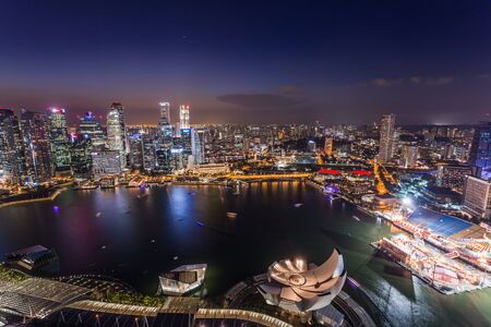 SINGAPORE - FEBRUARY 27, 2015: aerial view of sunset scene of Marina Bay. Marina Bay is one of the most famous tourist attraction in Singapore.のeditorial素材