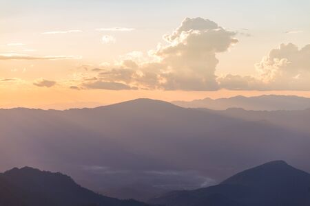 Sunset scene with silhouette mountain at Doi Luang Chiang Dao, Chiang Mai Province, Thailandの写真素材