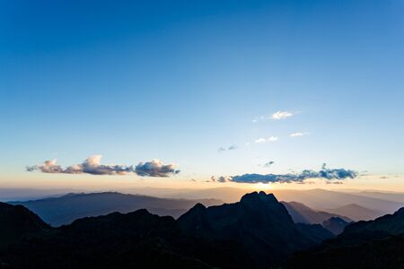 Sunset scene with silhouette mountain at Doi Luang Chiang Dao, Chiang Mai Province, Thailandの写真素材