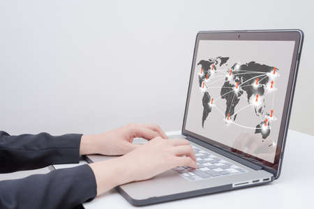 business woman use computer with social network concept on world map presentation