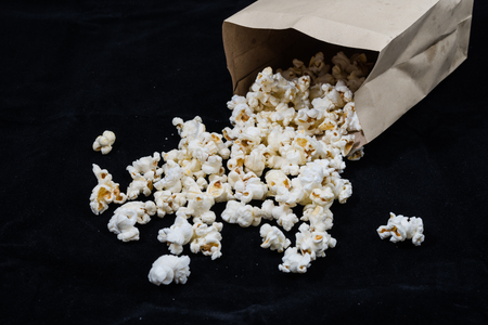 popcorn in brown bagの写真素材
