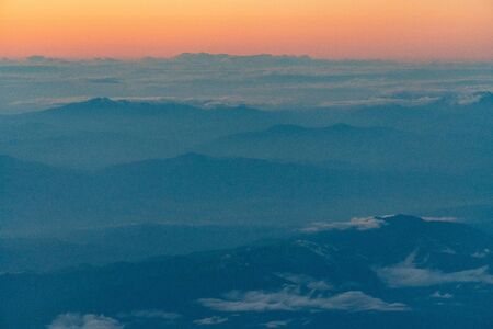 aerial of cloud and mountain in the eveningの写真素材