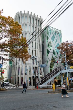 TOKYO, JAPAN - NOVEMBER 18, 2018: Day scene of Boss and Tods shop buildings at Omotesando road,...
