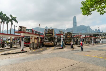 HONG KONG - NOVEMBER 10, 2018: Day scene of star ferry bus stop with Hong Kong skyline.のeditorial素材