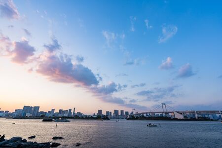 TOKYO, JAPAN - NOVEMBER 17, 2018: Sunset scene of Rainbow bridge and tokyo skyline at Odaiba, Tokyo, Japanのeditorial素材