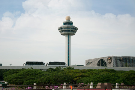 Changi Airport Control Tower in Singapore 3-1-2011 :This picture has an electric train for transporting passengers to the city and Changi Airport Control Towerのeditorial素材