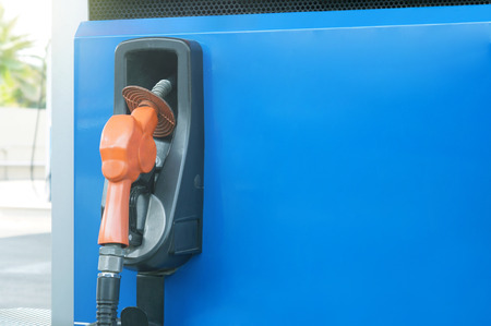 Fuel nozzle at gas station.  Concept /energy, Fuel dispensersの写真素材