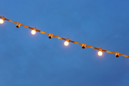 Halogen light bulbs hanging from the roof to the tree. It was introduced to various Festival...