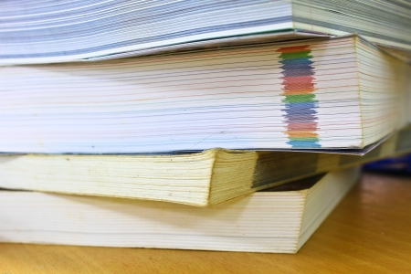 Pile of books on deskの写真素材