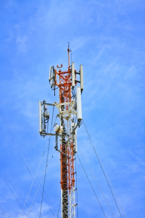 Telecommunication tower on blue skyの写真素材