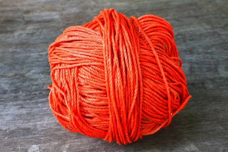 Bunch of red nylon rope on a wooden backgroundの写真素材