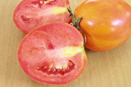 tomatos  on wood backgroundの写真素材