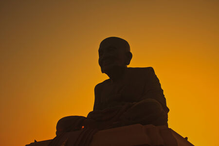 silhouette Luang Pu Thuat statue in Samut Prakan provinceの写真素材