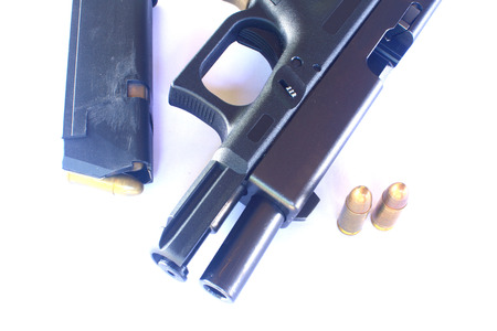 close up Gun with ammunition on white 