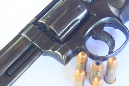 close up Gun with ammunition on white background