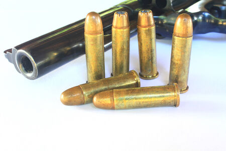 close up Gun with ammunition on white の写真素材