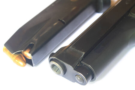 close up Gun with ammunition on white 