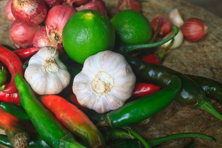 thai kitchen food spice herb pepper red onion garlic for cooking on top wood table の写真素材