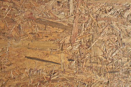 background and texture old recycled plywood chippings board 
