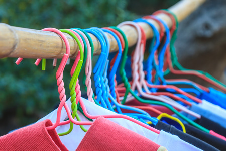 Shirts hanging on clothes line in morningの写真素材