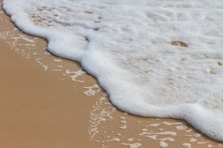 Soft wave of the sea on the sandy beach