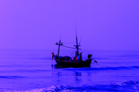 Fishing boat on the beach in summerの写真素材