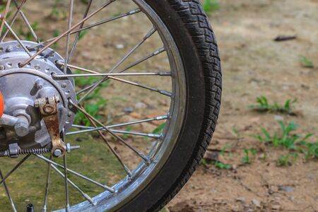 Wheels of motorcycles with tire l close up on the road.の写真素材
