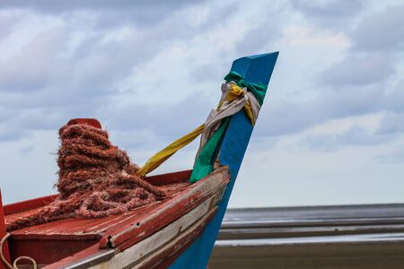 Fishing boat on the beach in summer