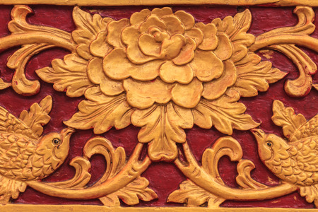 Pattern of flower carved on wood backgroundの写真素材