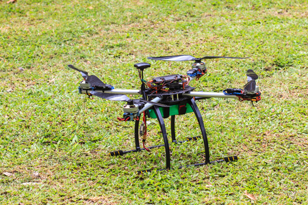 flying drone with camera on the groundの写真素材