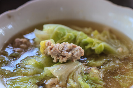 Clear vegetable soup with minced pork close upの写真素材